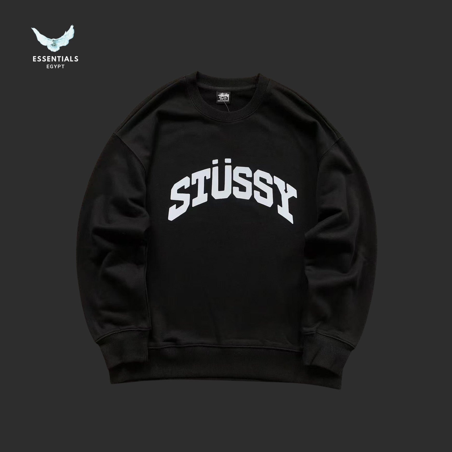 Black Stussy sweatshirt on a dark background