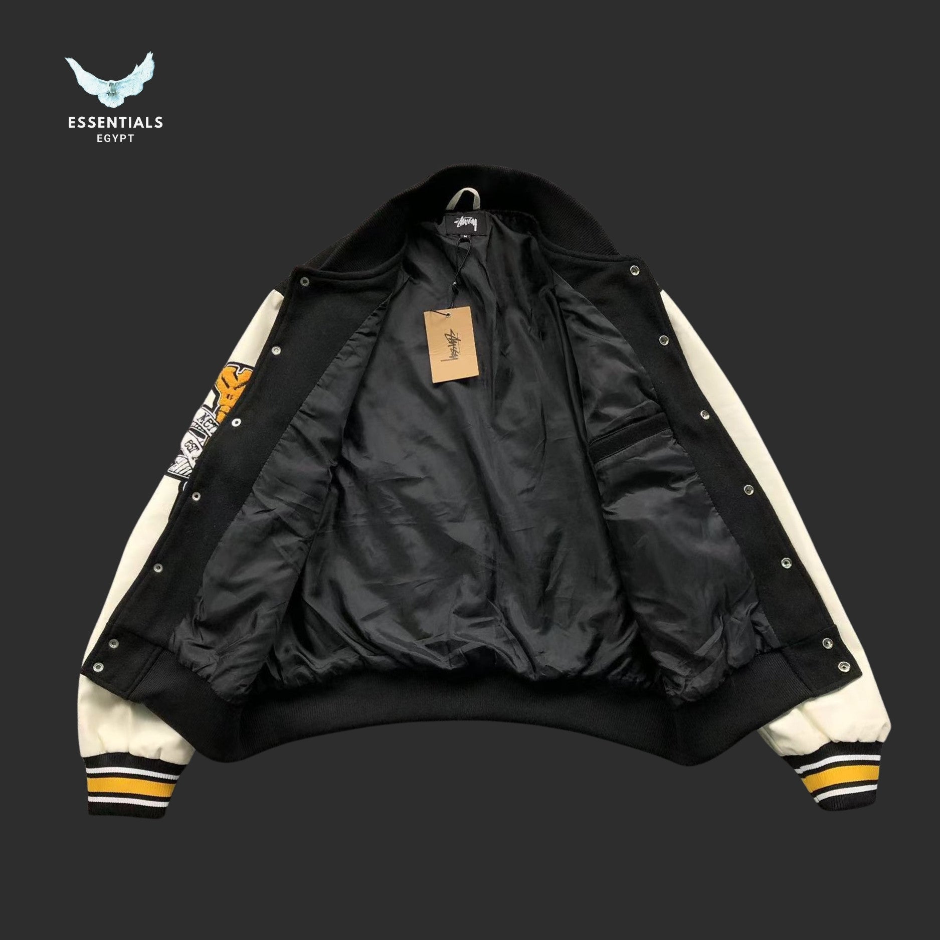 Stussy College Varsity Jacket 30 Patch in black with white sleeves