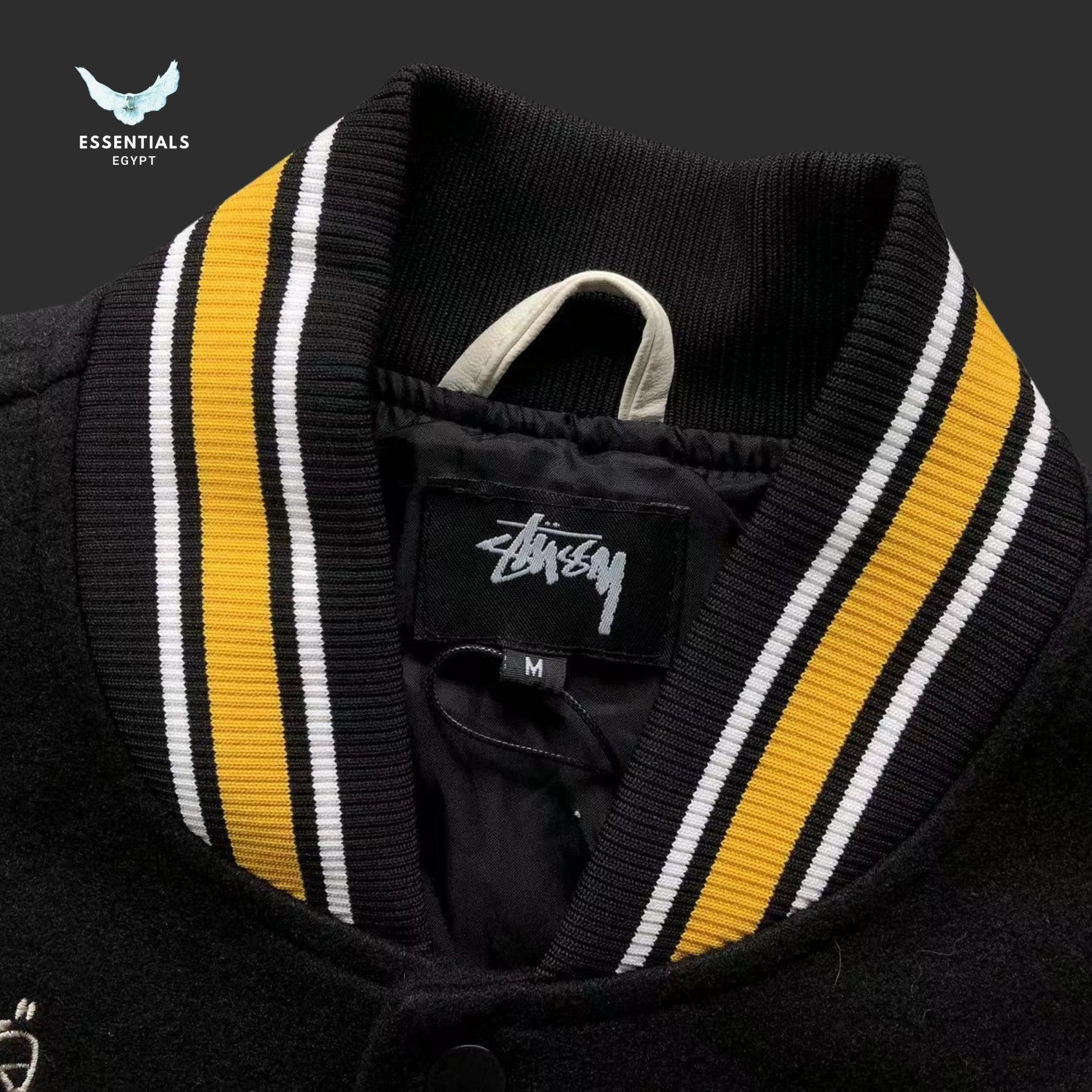 Stussy College Varsity Jacket 30 Patch in black with white sleeves