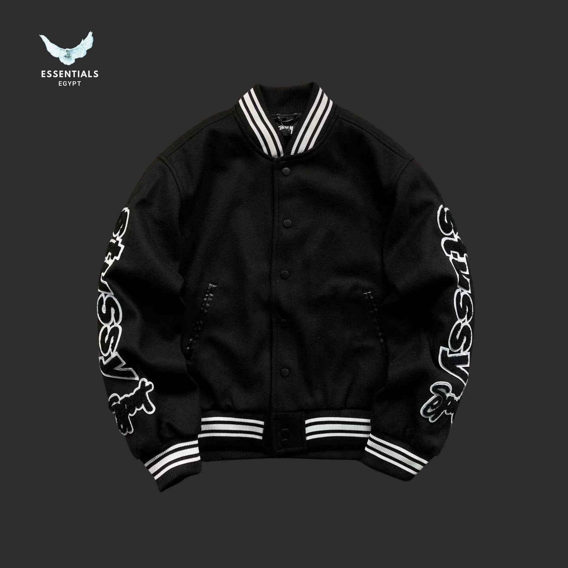Stussy Big Logo Varsity Jacket in black with oversized sleeve branding