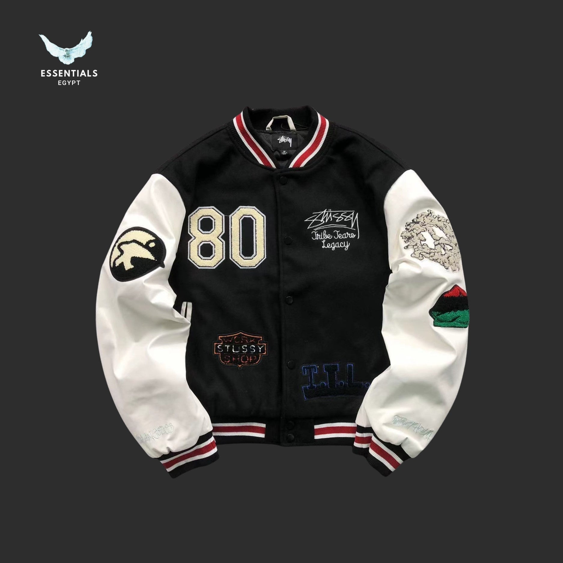 Stussy 80 Patch Varsity Jacket in black with white sleeves
