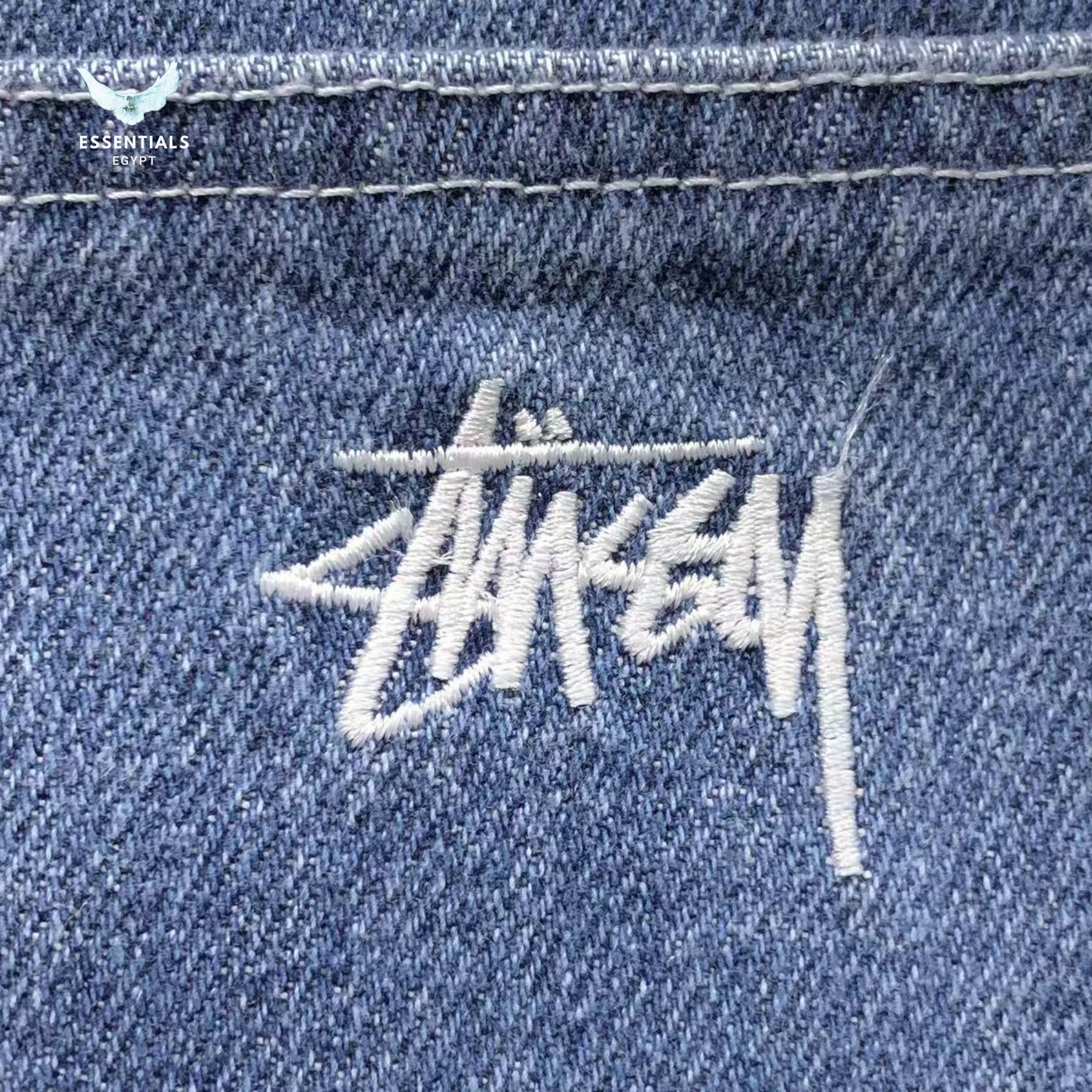 Front view of Stussy Denim Chore Jacket in blue denim